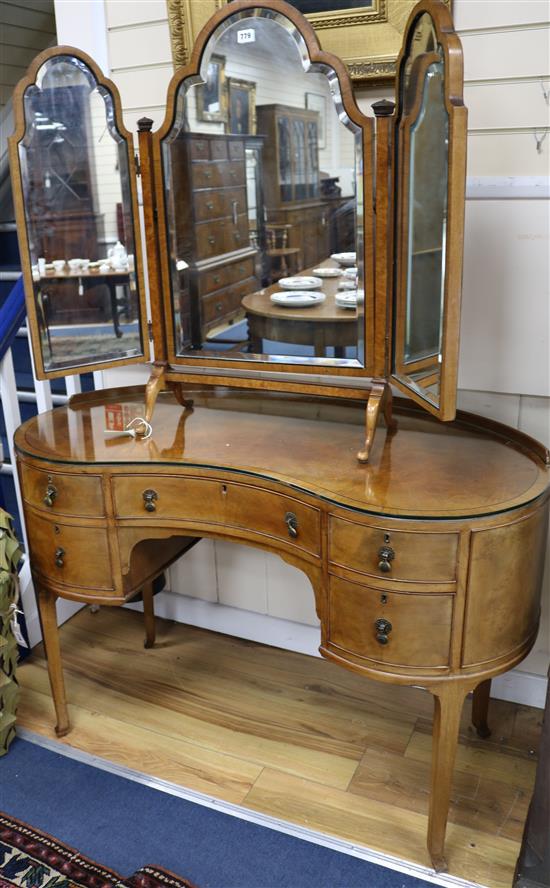 A kidney shaped dressing table, with triple mirror, W.120cm